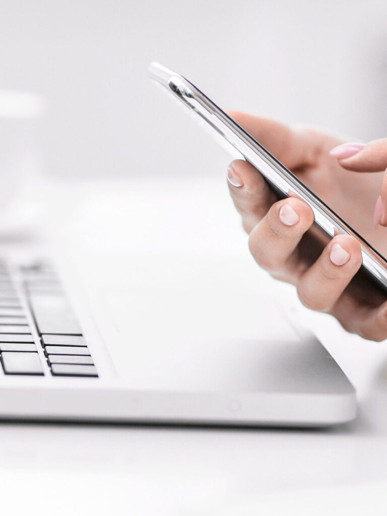 Unrecognizable girl writing message on line at work